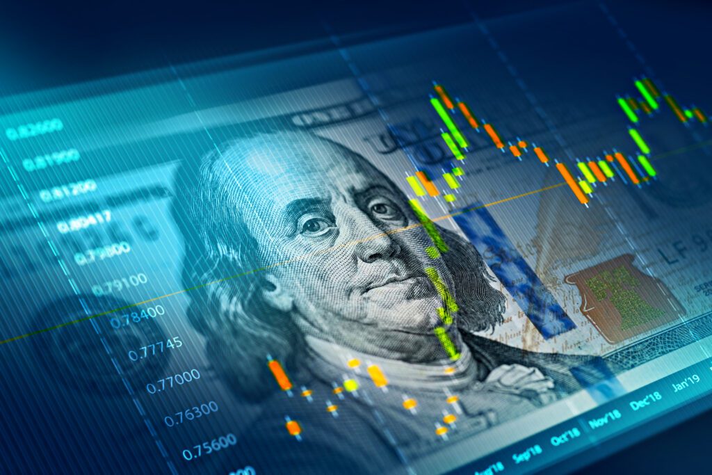 Financial chart overlay on hundred-dollar bill.